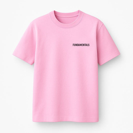Pink t-shirt with 'FUNDAMENTALS' text on a white background